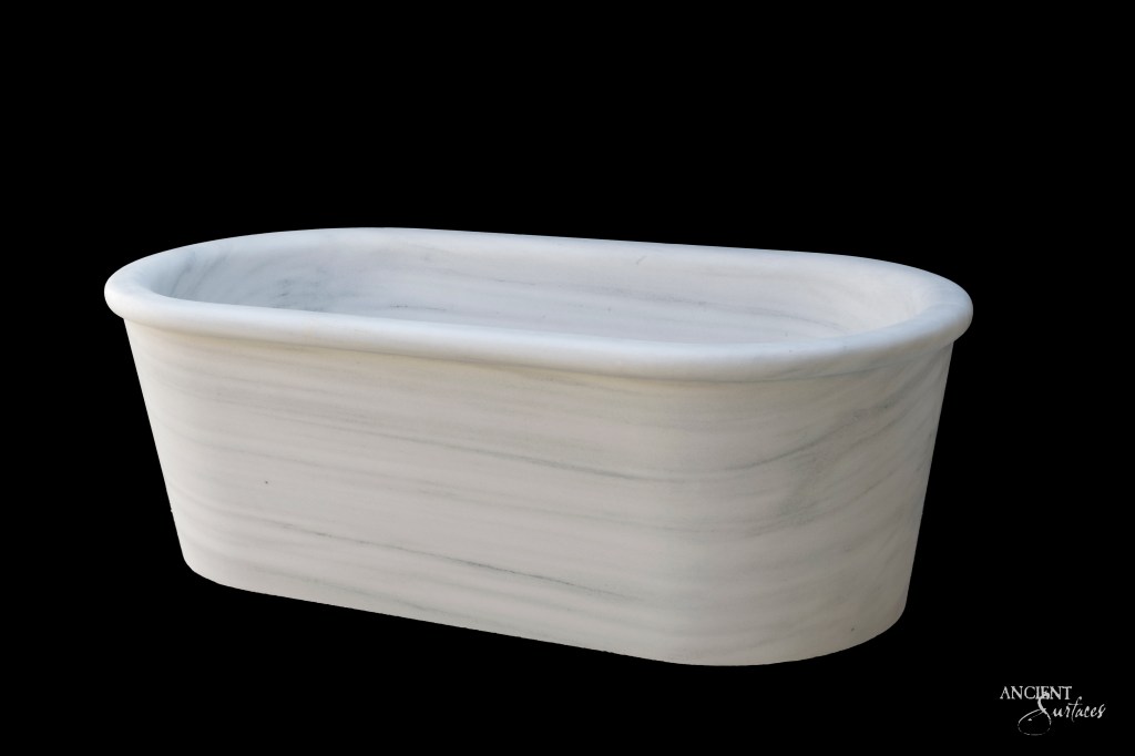 Smooth White Limestone Bathtub by Ancient Surfaces, exuding modern luxury with sleek lines and a polished surface, perfect for a minimalist, modern aesthetic.