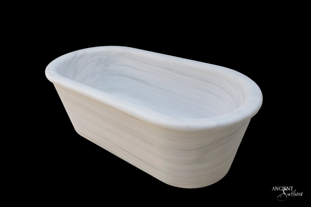 The popular Smooth White marble  Bathtub by Ancient Surfaces, reminiscent of the finest Greek marble.